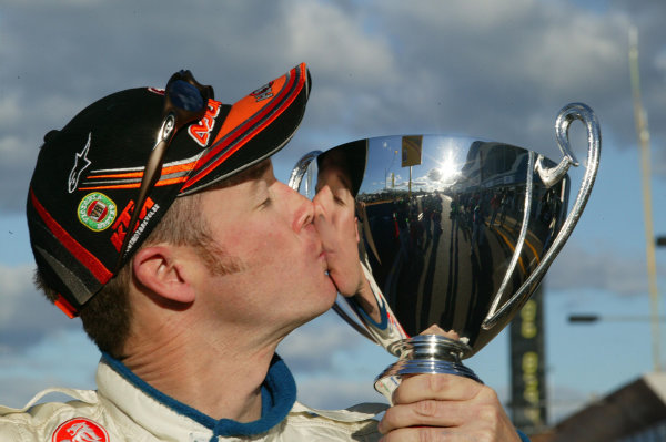 2003 Australian V8 Supercars
Bathurst 1000kms, Bathurst, Australia. 12th October 2003.
Holden V8 Supercar driver Greg Murphy kisses his pole award after taking pole. Murphy dominated the weekend breaking the lap record in qualifying and the Shootout, Kelly is the youngest driver to win at Bathurst.
World Copyright: Mark Horsburgh/ LAT Photographic 2003 Australian V8 Supercars
Bathurst 1000kms, Bathurst, Australia. 12th October 2003.
Holden V8 Supercar driver Greg Murphy kisses his pole award after taking pole. Murphy dominated the weekend breaking the lap record in qualifying and the Shootout, Kelly is the youngest driver to win at Bathurst.
World Copyright: Mark Horsburgh/ LAT Photographic