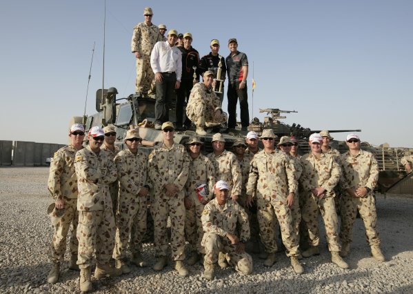 2007 Australian V8 Supercars.
Bahrain International Circuit. Sakhir, Bahrain.
2nd - 4th November. 
Craig Lowndes, Jason Bright, Rick Kelly,Greg Murphy with  Australian troops based at Tallil Airbase located approximately 310 kilometers Southeast of Baghdad, Iraq.
World Copyright: Mark Horsburgh/LAT Photographic. 
Ref: Digital Image V8-Drivers-IRAQ-7512