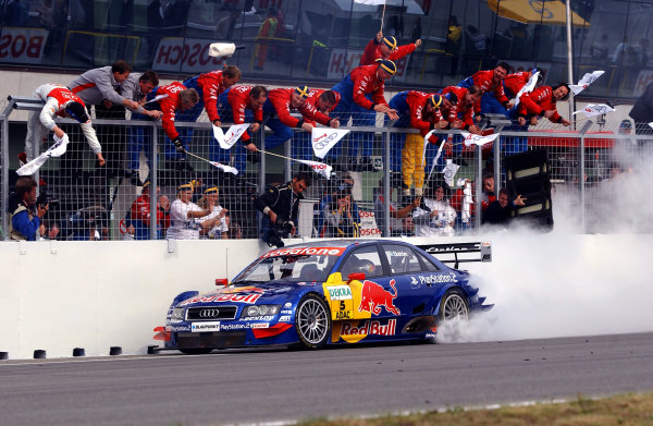 2004 DTM Championship 
Brno,Czech Republic. 18th - 19th September.
Winner Mattias Ekstrom (Abt Sportsline Audi A4) lights up his rear tyres as he crosses the line to the cheers of his team. Action.
World Copyright: Andre Irlmeier/LAT Photographic 
ref: Digital Image Only