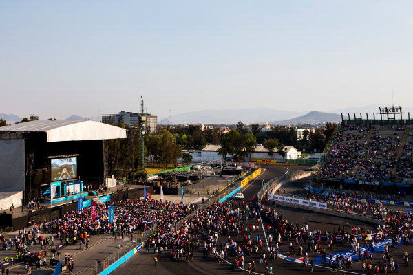 2015/2016 FIA Formula E Championship.
Mexico City ePrix, Autodromo Hermanos Rodriguez, Mexico City, Mexico.
Saturday 12 March 2016.
The fans make their way to the podium.
Photo: Zak Mauger/LAT/Formula E
ref: Digital Image _L0U8574 2015/2016 FIA Formula E Championship.
Mexico City ePrix, Autodromo Hermanos Rodriguez, Mexico City, Mexico.
Saturday 12 March 2016.
The fans make their way to the podium.
Photo: Zak Mauger/LAT/Formula E
ref: Digital Image _L0U8574