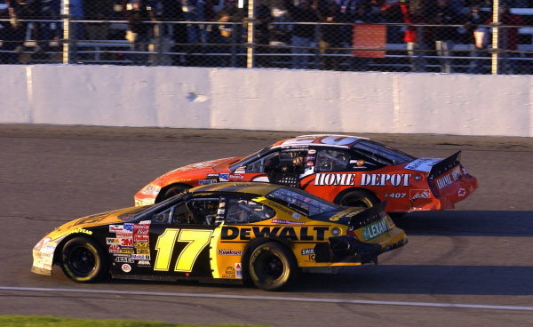 Matt Kenseth (USA), Smirnoff Ice/DeWalt Ford Taurus, (17) wins the 2003 Winston Cup. Tony Stewart (USA), Home Depot Chevrolet, passes him on the outside.
NASCAR Winston Cup Series, Rd35, Pop-Secret Microwave Popcorn 400, Rockingham, North Carolina, USA. 9 November 2003.
DIGITAL IMAGE Matt Kenseth (USA), Smirnoff Ice/DeWalt Ford Taurus, (17) wins the 2003 Winston Cup. Tony Stewart (USA), Home Depot Chevrolet, passes him on the outside.
NASCAR Winston Cup Series, Rd35, Pop-Secret Microwave Popcorn 400, Rockingham, North Carolina, USA. 9 November 2003.
DIGITAL IMAGE