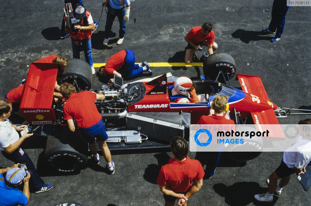 Alan Jones, Lola THL-1 Hart, in the pits as a mechanic works on the car. Alan Jones, Lola THL-1 Hart, in the pits as a mechanic works on the car.