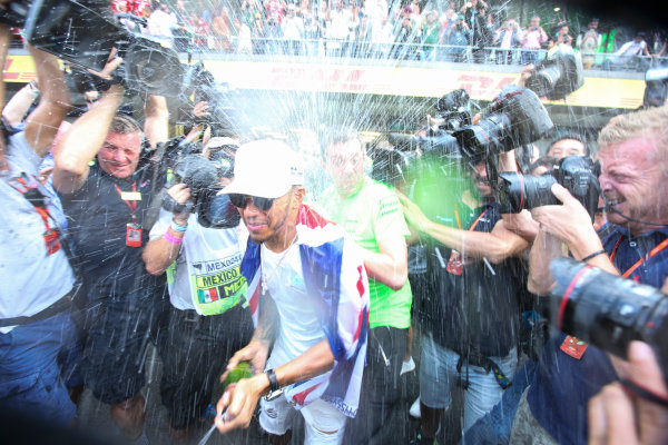 Autodromo Hermanos Rodriguez, Mexico City, Mexico.
Sunday 29 October 2017.
Lewis Hamilton, Mercedes AMG, sprays Champagne at photographers in celebration of securing his 4th world drivers championship title.
World Copyright: Charles Coates/LAT Images
ref: Digital Image DJ5R7723 Autodromo Hermanos Rodriguez, Mexico City, Mexico.
Sunday 29 October 2017.
Lewis Hamilton, Mercedes AMG, sprays Champagne at photographers in celebration of securing his 4th world drivers championship title.
World Copyright: Charles Coates/LAT Images
ref: Digital Image DJ5R7723