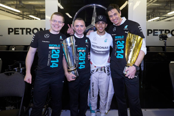 Yas Marina Circuit, Abu Dhabi, United Arab Emirates.
Sunday 23 November 2014. 
Andy Cowell, Paddy Lowe, Lewis Hamilton and Toto Wolff, Mercedes AMG, celebrate championship victory. 
World Copyright: Steve Etherington/LAT Photographic.
ref: Digital Image SNE13530