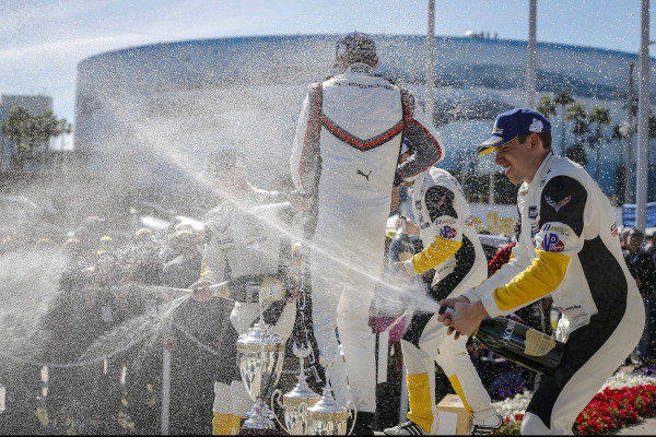 #4 Corvette Racing Corvette C7.R, GTLM: Oliver Gavin, Tommy Milner, #912 Porsche GT Team Porsche 911 RSR, GTLM: Earl Bamber, Laurens Vanthoor, #3 Corvette Racing Corvette C7.R, GTLM: Jan Magnussen, Antonio Garcia celebrate on the podium with champagne #4 Corvette Racing Corvette C7.R, GTLM: Oliver Gavin, Tommy Milner, #912 Porsche GT Team Porsche 911 RSR, GTLM: Earl Bamber, Laurens Vanthoor, #3 Corvette Racing Corvette C7.R, GTLM: Jan Magnussen, Antonio Garcia celebrate on the podium with champagne