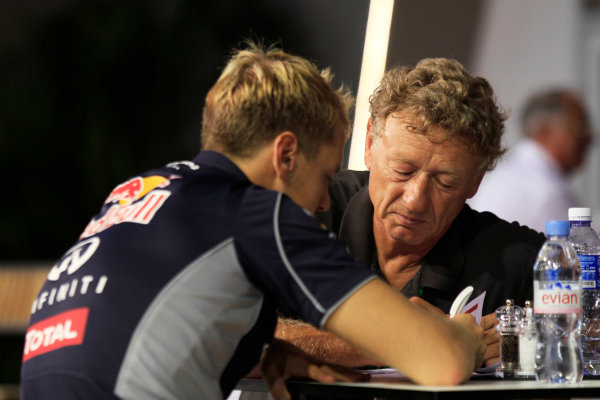 Marina Bay Circuit, Singapore.
Saturday 21st September 2013.
Sebastian Vettel, Red Bull Racing talks with F1 circuit designer Hermann Tilke.
World Copyright: Charles Coates/LAT Photographic.
ref: Digital Image _X5J9726 Marina Bay Circuit, Singapore.
Saturday 21st September 2013.
Sebastian Vettel, Red Bull Racing talks with F1 circuit designer Hermann Tilke.
World Copyright: Charles Coates/LAT Photographic.
ref: Digital Image _X5J9726