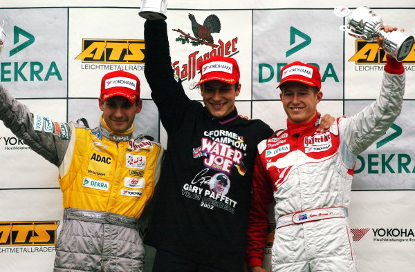 Podium of the Saturday race. Winner and 2002 champion: Gary Paffett (GBR), Team Rosberg, centre; 2nd: Timo Glock (GER) Opel Team KMS, left; 3rd: Ryan Briscoe (AUS), Prema Powerteam, right.
German Formula 3 Championship, Rd10, Hockenheim, Germany, 5-6 October 2002.
DIGITAL IMAGE