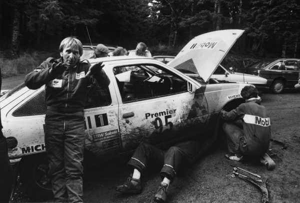 Chester, England. 22nd - 25th November 1987.
Derek Bell/Mike Nicholson (Opel Kadett GSI), retired, in a service area, portrait. 
World Copyright: LAT Photographic.
Ref:  B/W Print.