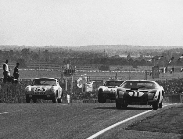 Le Mans, France. 20th - 21st June 1964.
Richie Ginther/Masten Gregory (Ford GT40), retired, passes Bob Bondurant/Dan Gurney (AC Cobra Daytona ), 4th position and Clive Baker/Bill Bradley (Austin-Healey Sprite), 24th position, action.
World Copyright: LAT Photographic.
Ref: B/WPRINT. Le Mans, France. 20th - 21st June 1964.
Richie Ginther/Masten Gregory (Ford GT40), retired, passes Bob Bondurant/Dan Gurney (AC Cobra Daytona ), 4th position and Clive Baker/Bill Bradley (Austin-Healey Sprite), 24th position, action.
World Copyright: LAT Photographic.
Ref: B/WPRINT.