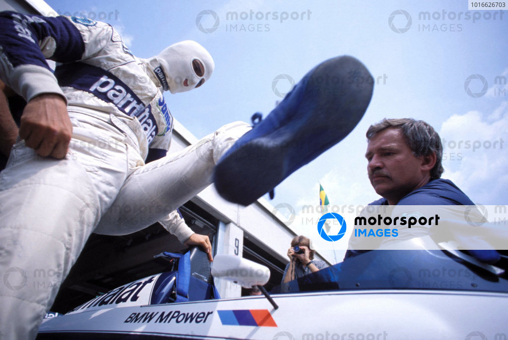 Nelson Piquet climbs into his Brabham BT52B BMW. Nelson Piquet climbs into his Brabham BT52B BMW.