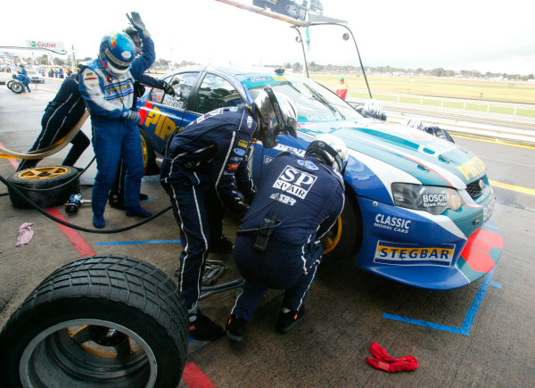 2003 Australian V8 Supercars, Round 9, Sandown, 14th September 2003.
V8 Supercar drivers Marcos Ambrose and Russell Ingall compleat there driver change during a pitstop in the Betta Electrical 500 held at Sandown International Raceway Melbourne, Australia this weekend.
Photo: Mark Horsburgh/LAT Photographic 2003 Australian V8 Supercars, Round 9, Sandown, 14th September 2003.
V8 Supercar drivers Marcos Ambrose and Russell Ingall compleat there driver change during a pitstop in the Betta Electrical 500 held at Sandown International Raceway Melbourne, Australia this weekend.
Photo: Mark Horsburgh/LAT Photographic