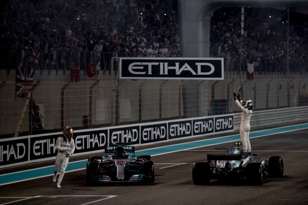 Yas Marina Circuit, Abu Dhabi, United Arab Emirates.
Sunday 26 November 2017.
Lewis Hamilton, Mercedes AMG, 2nd Position, and Valtteri Bottas, Mercedes AMG, 1st Position, celebrate at the end of the race.
World Copyright: Glenn Dunbar/LAT Images 
ref: Digital Image _31I9229