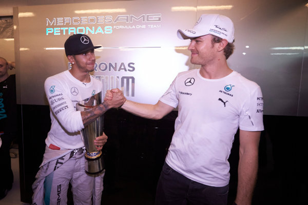 Yas Marina Circuit, Abu Dhabi, United Arab Emirates.
Sunday 23 November 2014. 
Nico Rosberg, Mercedes AMG, congratulates teammate Lewis Hamilton on his championship victory. 
World Copyright: Steve Etherington/LAT Photographic.
ref: Digital Image SNE13520