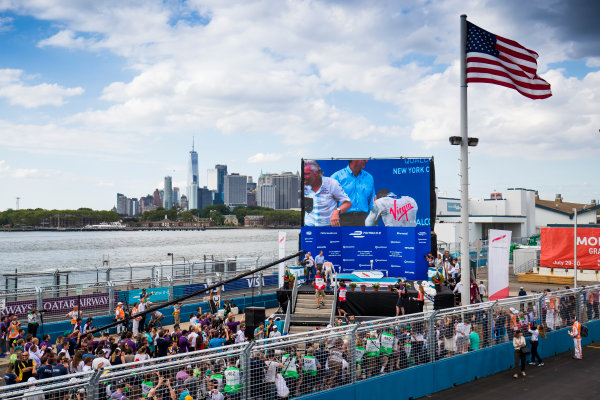 2016/2017 FIA Formula E Championship.
Round 9 - New York City ePrix, Brooklyn, New York, USA.
Saturday 15 July 2017.
Sam Bird (GBR), DS Virgin Racing, Spark-Citroen, Virgin DSV-02,Jean-Eric Vergne (FRA), Techeetah, Spark-Renault, Renault Z.E 16, and Stephane Sarrazin (FRA), Techeetah, Spark-Renault, Renault Z.E 16, celerate on the podium.
Photo: Sam Bloxham/LAT/Formula E
ref: Digital Image _W6I2864