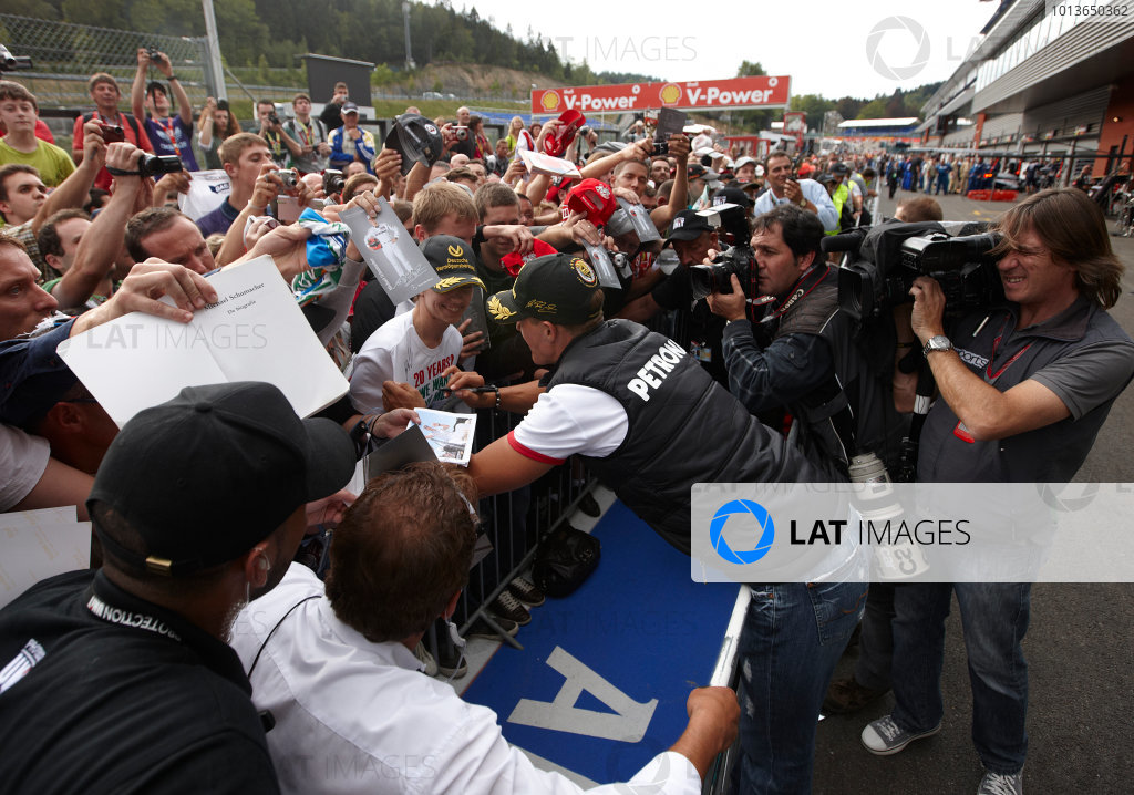 Spa-Francorchamps, Spa, Belgium
25th August 2011.
Michael Schumacher, Mercedes GP W02, signs autographs for fans. Portrait. Atmosphere.
World Copyright: Steve Etherington/LAT Photographic
ref: Digital Image SNE26538 Spa-Francorchamps, Spa, Belgium
25th August 2011.
Michael Schumacher, Mercedes GP W02, signs autographs for fans. Portrait. Atmosphere.
World Copyright: Steve Etherington/LAT Photographic
ref: Digital Image SNE26538