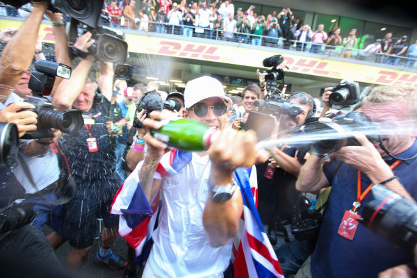 Autodromo Hermanos Rodriguez, Mexico City, Mexico.
Sunday 29 October 2017.
Lewis Hamilton, Mercedes AMG, sprays Champagne at photographers in celebration of securing his 4th world drivers championship title.
World Copyright: Charles Coates/LAT Images 
ref: Digital Image DJ5R7714