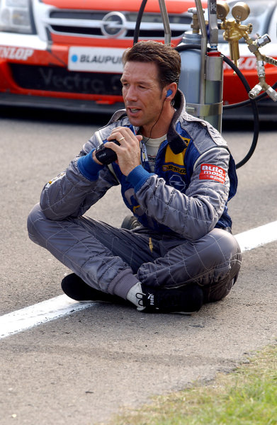 2004 DTM Championship
Zandvoort, Netherlands. 4th - 5th September.
Manuel Reuter (OPC Holzer Opel Vectra GTS) ponders the possible consequences of Peter Dumbreck's accident as the paddock waits for news of his condition. Portrait. 
World Copyright: Andre Irlmeier/LAT Photographic
ref: Digital Image Only