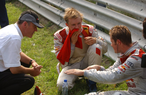 2004 DTM Championship
Zandvoort, Netherlands. 4th - 5th September.
Mattias Ekstrom (Abt Sportsline Audi A4) and Martin Tomczyk (Abt Sportsline Audi A4) discuss Peter Dumbreck's accident with Dr Wolfgang Ullrich (Audi).
World Copyright: Andre Irlmeier/LAT Photographic
ref: Digital Image Only 2004 DTM Championship
Zandvoort, Netherlands. 4th - 5th September.
Mattias Ekstrom (Abt Sportsline Audi A4) and Martin Tomczyk (Abt Sportsline Audi A4) discuss Peter Dumbreck's accident with Dr Wolfgang Ullrich (Audi).
World Copyright: Andre Irlmeier/LAT Photographic
ref: Digital Image Only