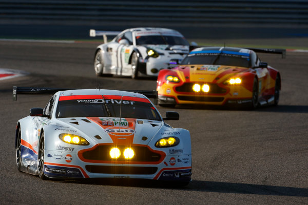 2015 FIA World Endurance Championship
Bahrain 6-Hours
Bahrain International Circuit, Bahrain
Saturday 21 November 2015.
Christoffer Nygaard, Marco S?rensen, Nicki Thiim (#95 GTE PRO Aston Martin Racing Aston Martin Vantage V8) leads Alex MacDowall, Fernando Rees, Richie Stanaway (#99 GTE PRO Aston Martin Racing Aston Martin Vantage V8) an Patrick Pilet, Fr?d?ric Makowiecki (#92 GTE PRO Porsche AG Team Manthey Porsche 911 RSR).
World Copyright: Alastair Staley/LAT Photographic
ref: Digital Image _79P0051