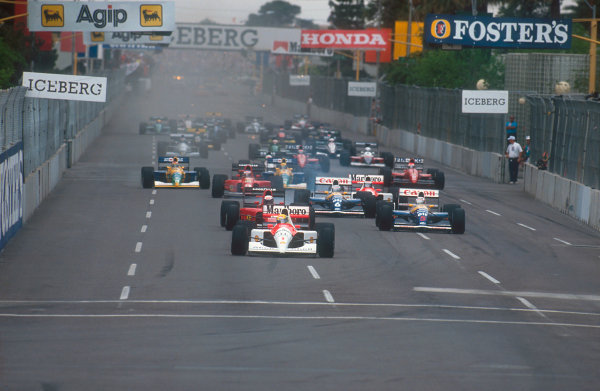 1991 United States Grand Prix.
Phoenix, Arizona, U.S
A.
8-10 March 1991.
Ayrton Senna (McLaren MP4/6 Honda) leads Alain Prost (Ferrari 642), Nigel Mansell, Riccardo Patrese (both Williams FW14 Renault's), Gerhard Berger (McLaren MP4/6 Honda), Jean Alesi (Ferrari 642), Nelson Piquet and Roberto Moreno (both Benetton B190B Ford's) at the start.
Ref-91 USA 19.
World Copyright - LAT Photographic
1991 United States Grand Prix.
Phoenix, Arizona, U.S
A.
8-10 March 1991.
Ayrton Senna (McLaren MP4/6 Honda) leads Alain Prost (Ferrari 642), Nigel Mansell, Riccardo Patrese (both Williams FW14 Renault's), Gerhard Berger (McLaren MP4/6 Honda), Jean Alesi (Ferrari 642), Nelson Piquet and Roberto Moreno (both Benetton B190B Ford's) at the start.
Ref-91 USA 19.
World Copyright - LAT Photographic