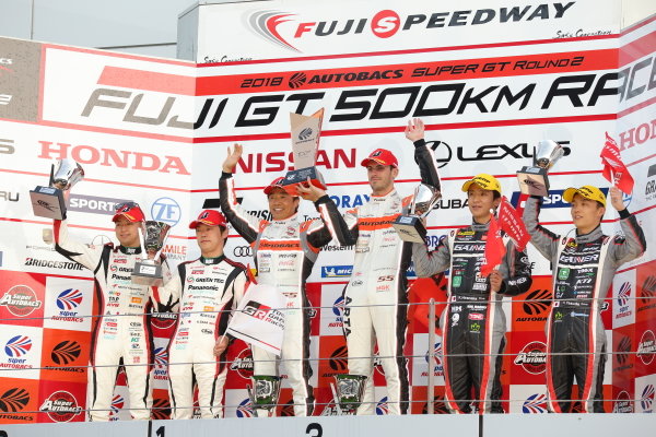 The GT300 winning drivers of the Arta (Autobas Racing Team Aguri) BMW M6 GT3, Shinichi Takagi & Sean Walkinshaw, celebrate on the podium. The second placed Koki Saga & Kohei Hirate, Toyota Prius apr GT, also celebrate, along with Katsuyuki Hiranaka & Hironobu Yasuda of the third position Gainer Tanax Nissan GT-R.