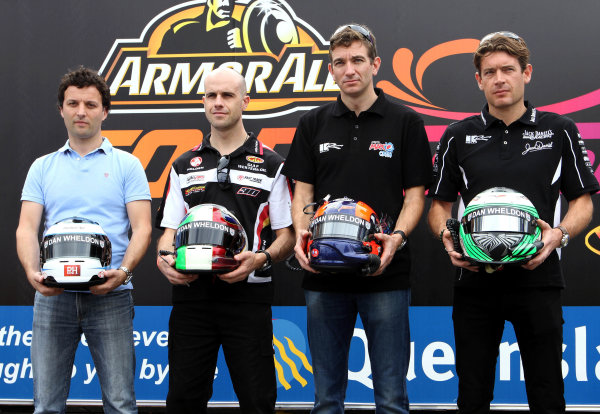 20-23 October, 2011, Surfers Paradise, AustraliaDarren Turner, Marino Franchitti, Oliver Gavin and Richard Westbrook show off the Dan Wheldon Visor strips on their helmets during the Armor All Gold Coast 600, event 11 of the 2011 Australian V8 Supercar Championship Series at the Gold Coast Street Circuit, Gold Coast, Queensland, ÃÂ©2011, Marshall PruettEDITORIAL USAGE ONLY