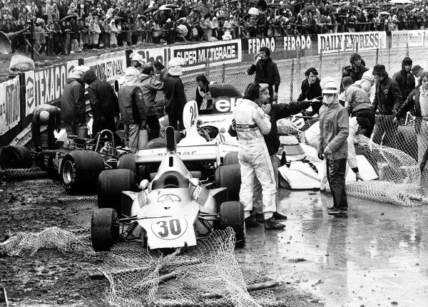 1975 British Grand Prix.
Silverstone, Great Britain. 17-19 July 1975.
The crashed cars of Wilson Fittipaldi (#30 Fittipaldi FD03-Ford Cosworth), James Hunt (#24 Hesketh 308-Ford Cosworth) and Brian Henton (Lotus 72E-Ford Cosworth). Heavy rain caused the race to be stopped early. Accident.
World Copyright: LAT Photographic
Ref: 7732#33 1975 British Grand Prix.
Silverstone, Great Britain. 17-19 July 1975.
The crashed cars of Wilson Fittipaldi (#30 Fittipaldi FD03-Ford Cosworth), James Hunt (#24 Hesketh 308-Ford Cosworth) and Brian Henton (Lotus 72E-Ford Cosworth). Heavy rain caused the race to be stopped early. Accident.
World Copyright: LAT Photographic
Ref: 7732#33